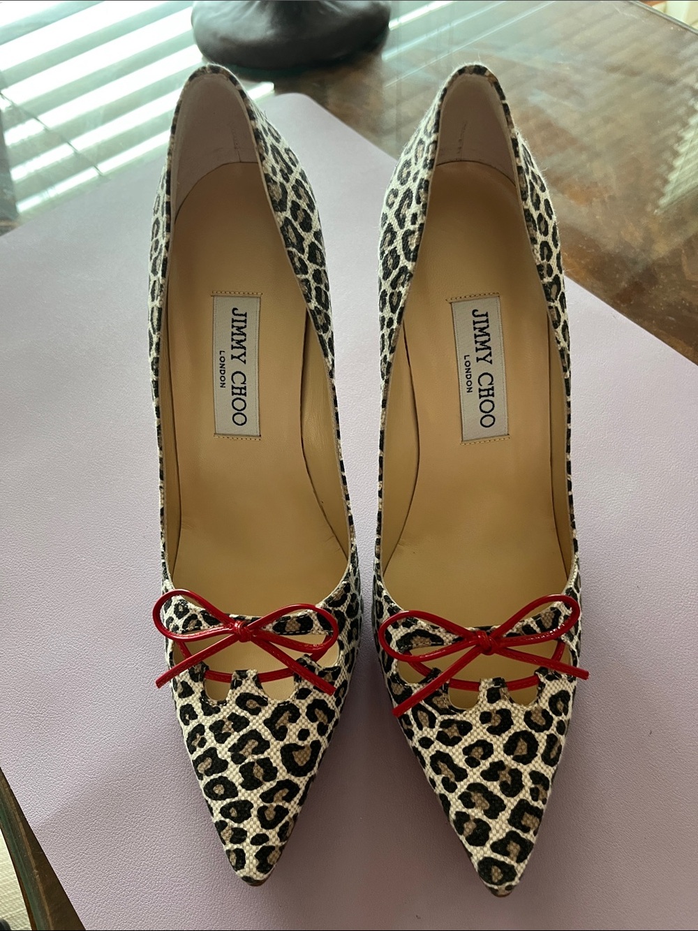 Jimmy Choo Leopard Print Pointed Pumps with Red Bow